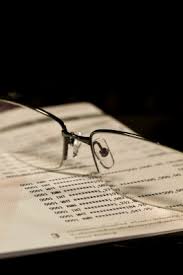 Eye glasses witting on top of a Medical Billing statement